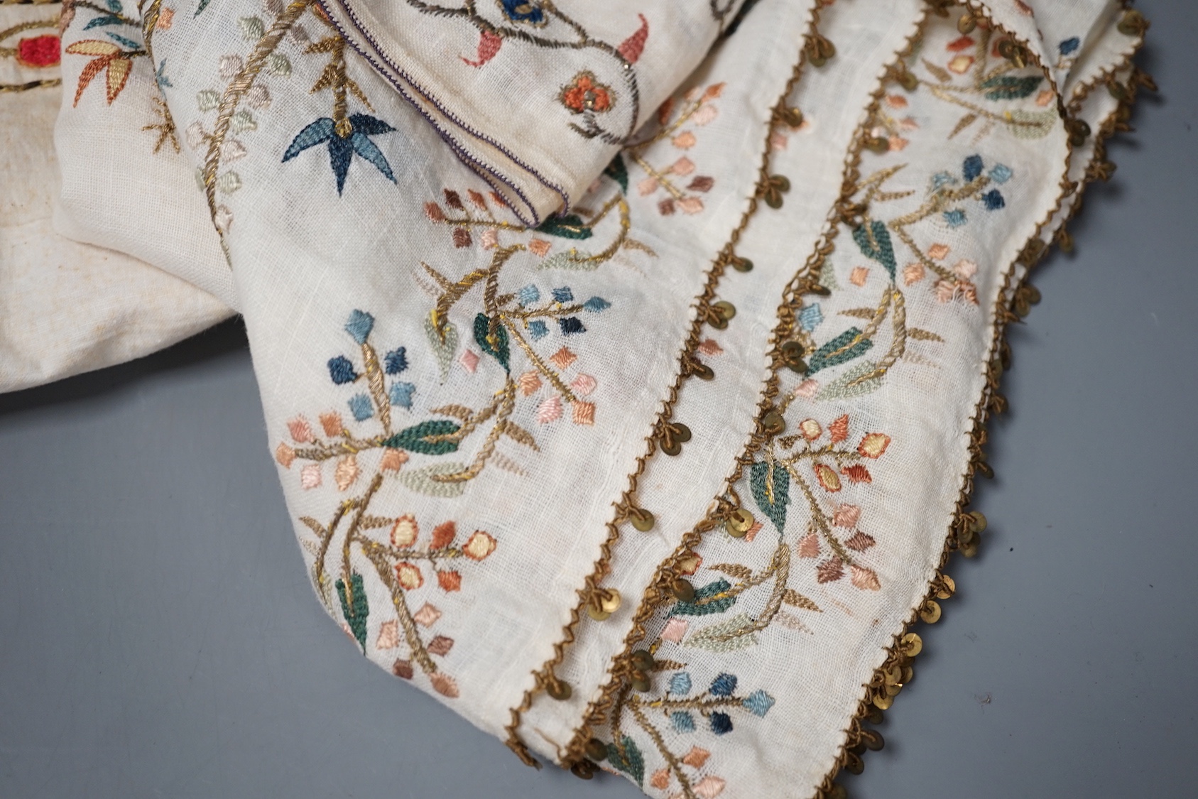 A collection of 19th century Turkish towels and runners, etc., embroidered with gold and silver and polychrome threads